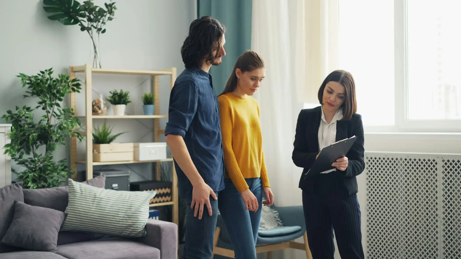 Man and woman standing together in a bright living room