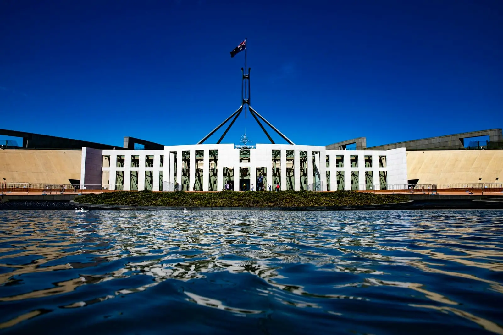 Parliament House Canberra with flag flying on top of the building