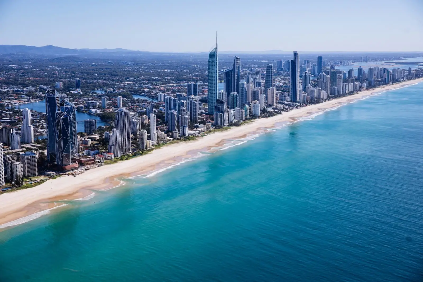 Aerial view of Surfers Paradise high-rise buildings beside the beach and sea