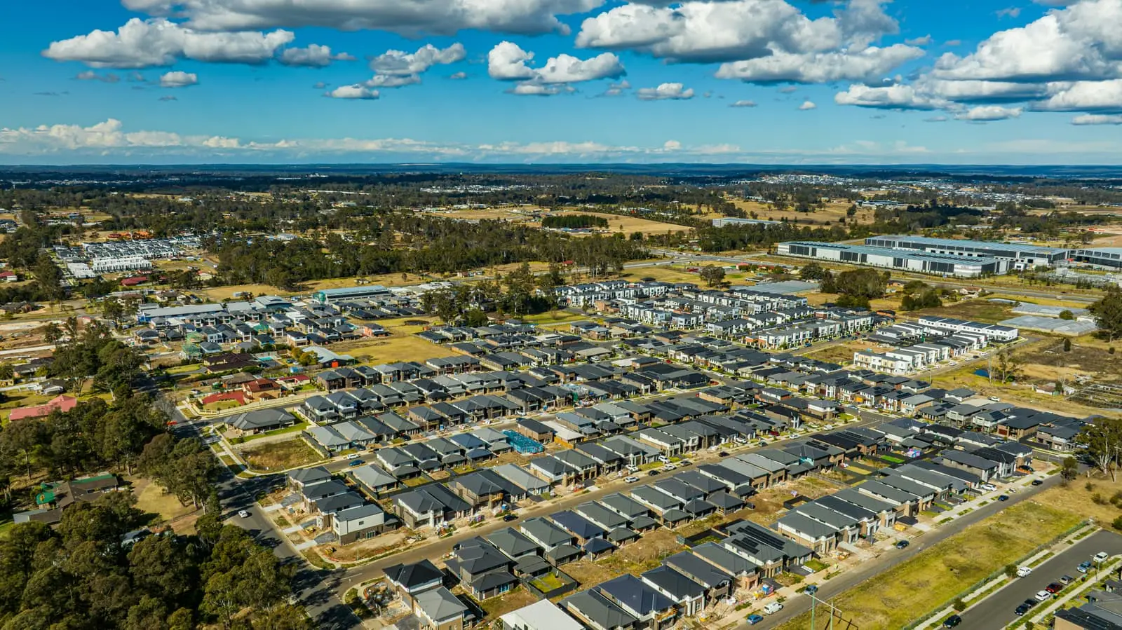 Aerial view of a suburban housing development with many homes